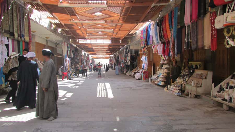 Luxor City Tour by Horse Carriage Visit Local - The souq pass: a market scene with real shopping energy